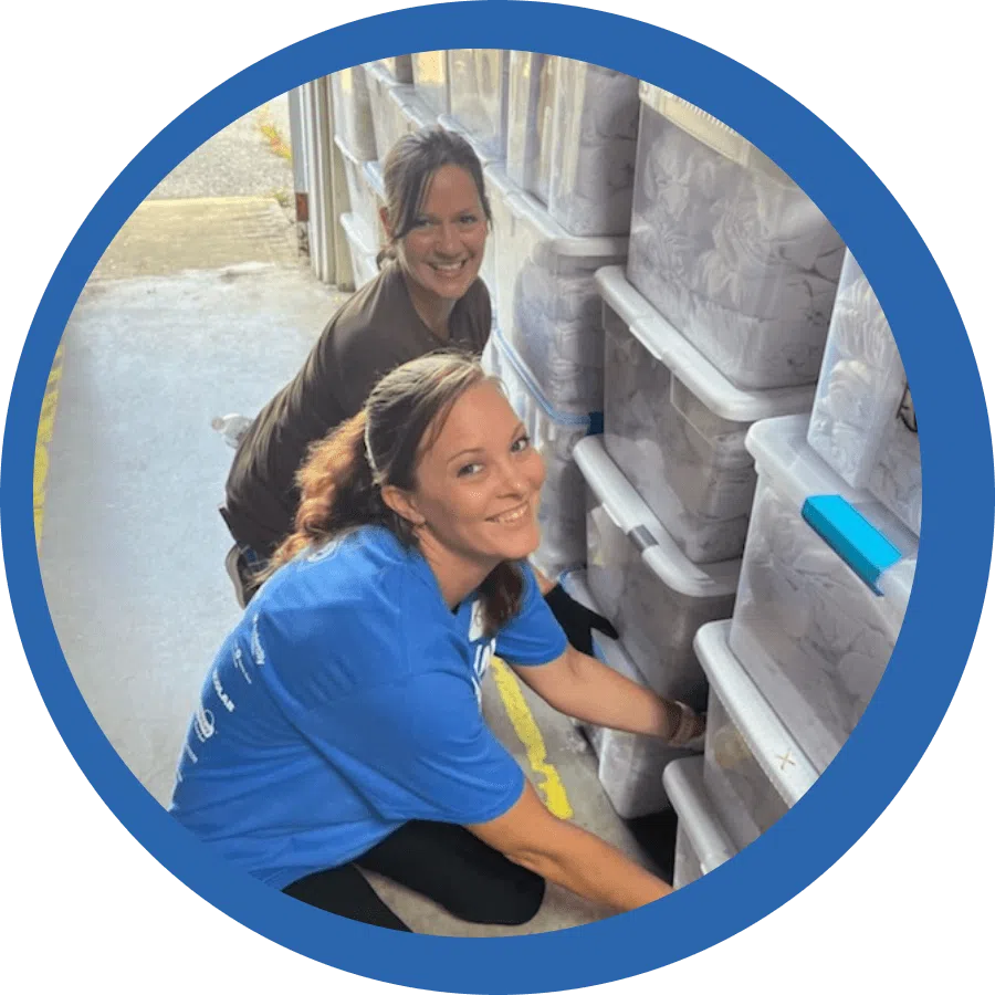 Two women Stacking supplies