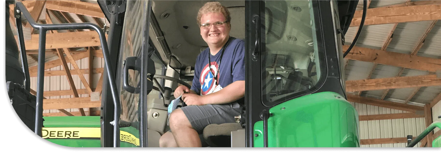 Worker Smiling in Tractor