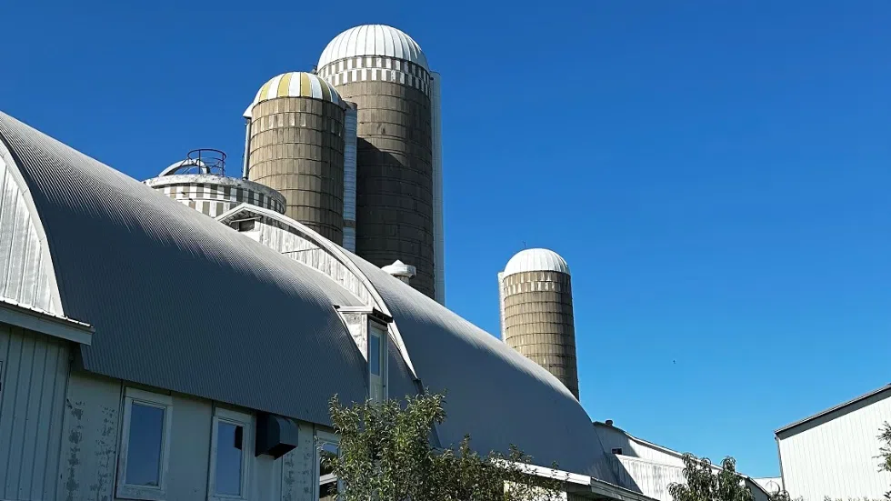Barn and silos with blue sky