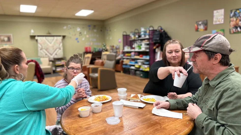 Nurses assisting clients during mealtime